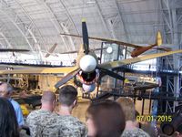Crew looks at World War II aircraft