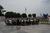 Band plays under the American Flag